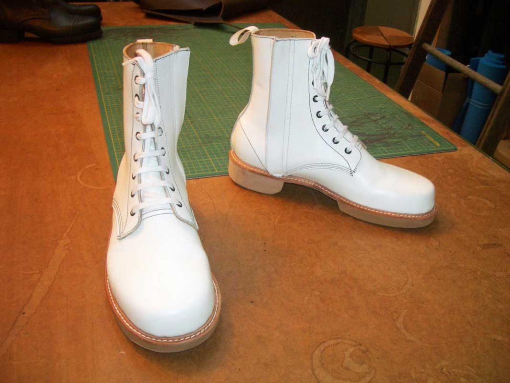 a pair of custom white lace-up boots