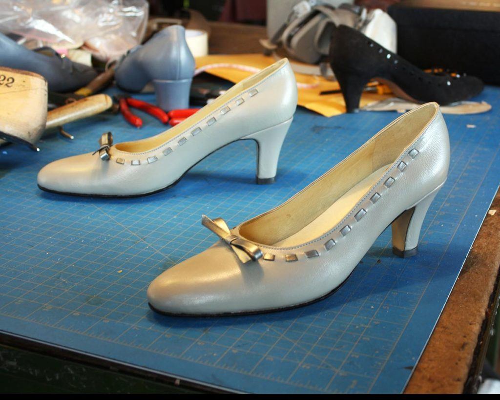 a pair of custom white high heels
