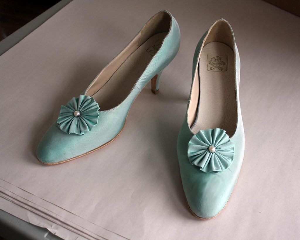 a pair of custom blue high heels
