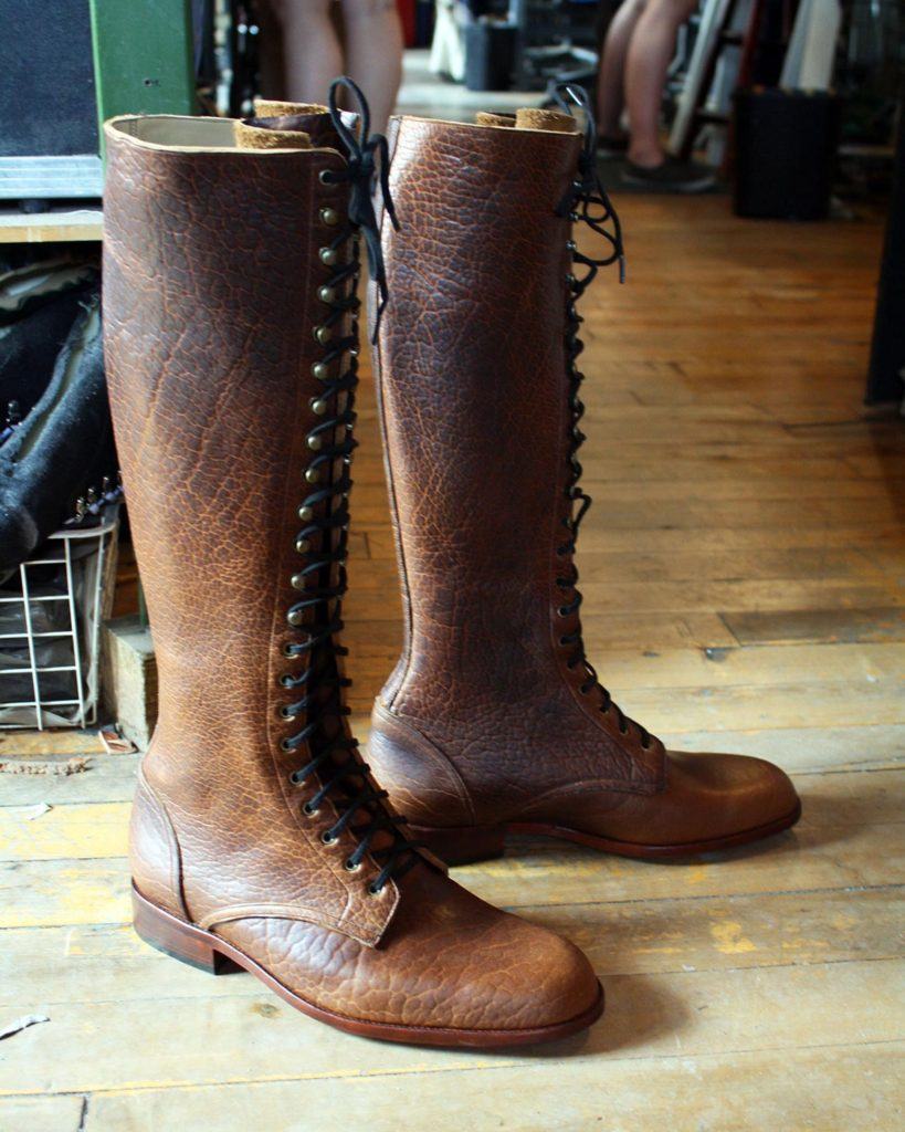 a pair of custom brown leather boots