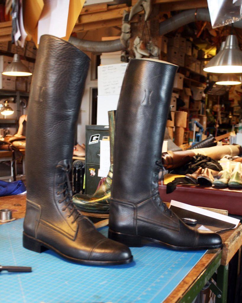 a pair of custom brown leather boots