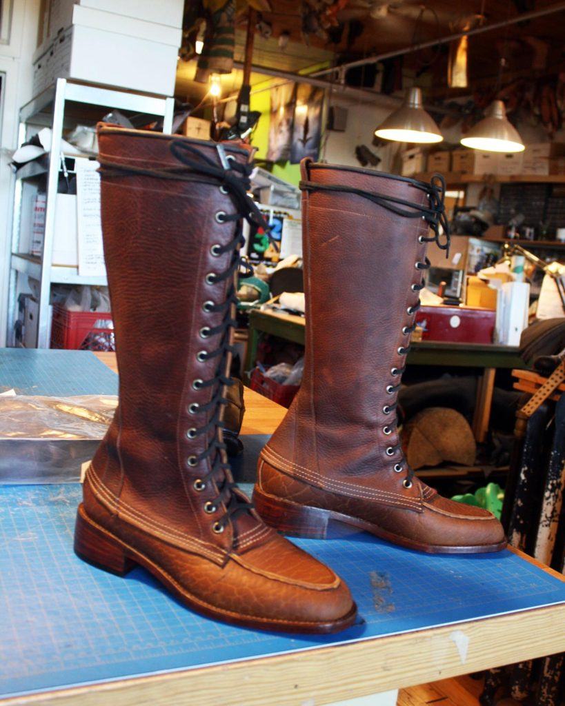 a pair of custom brown leather boots
