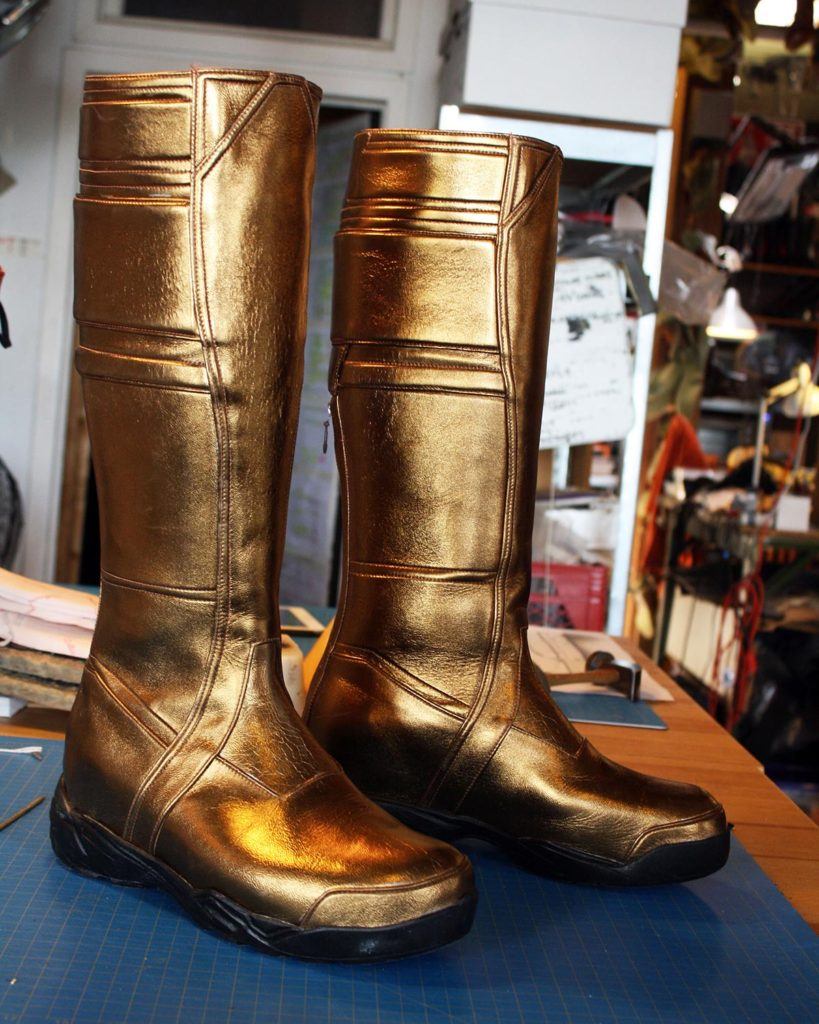 a pair of custom gold boots