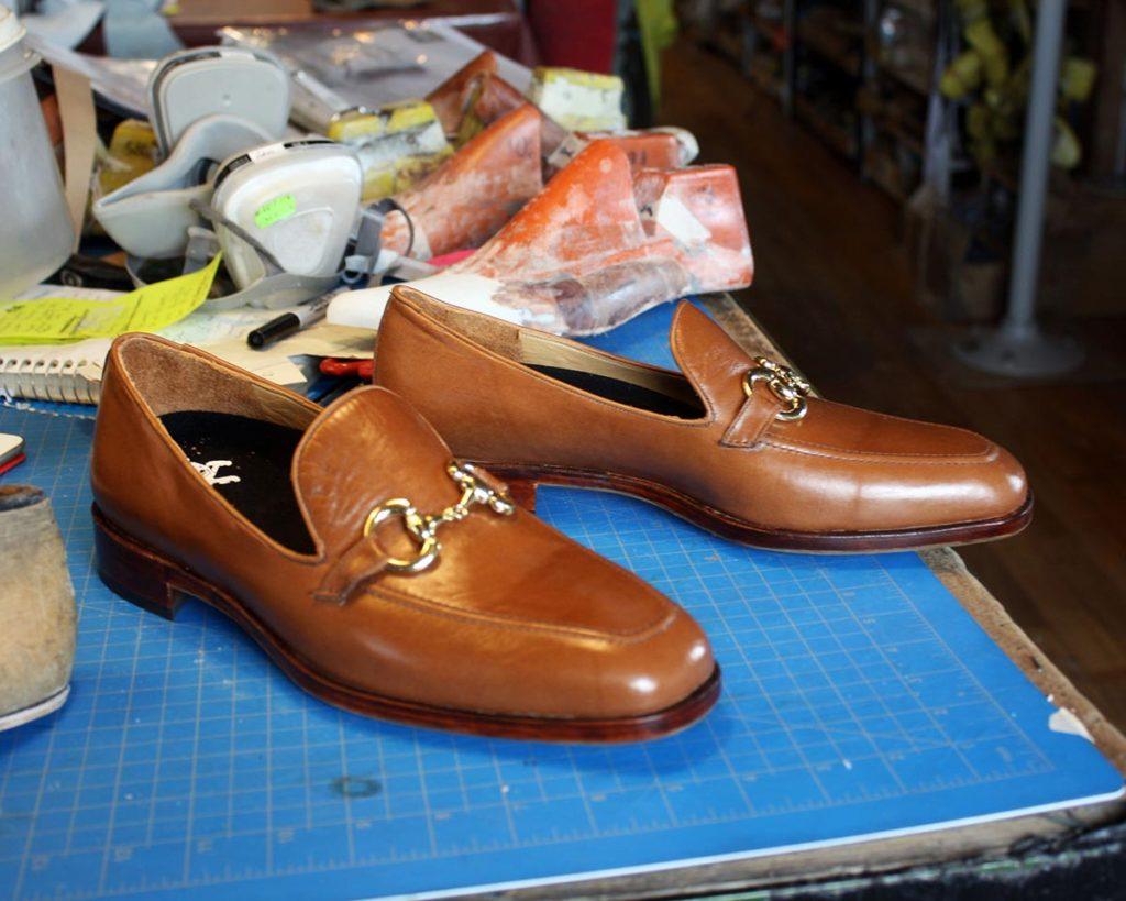 a pair of custom brown leather loafers