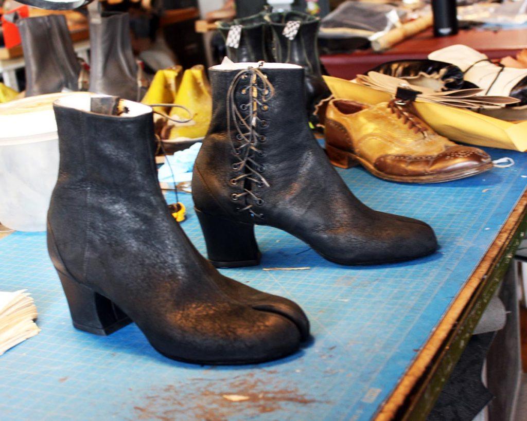 a pair of custom black leather ankle boots