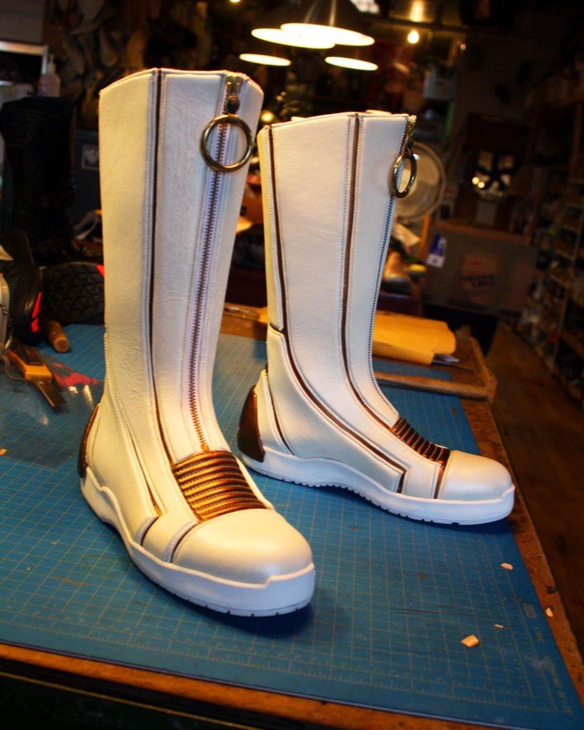 a pair of custom white sci-fi boots