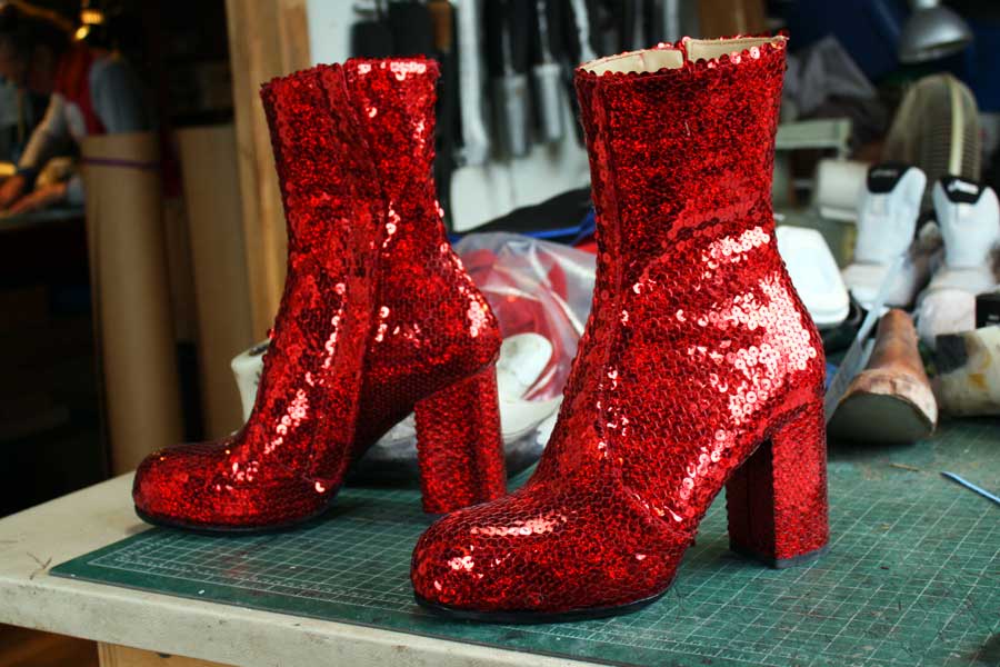 a pair of red sequin shoes with heels