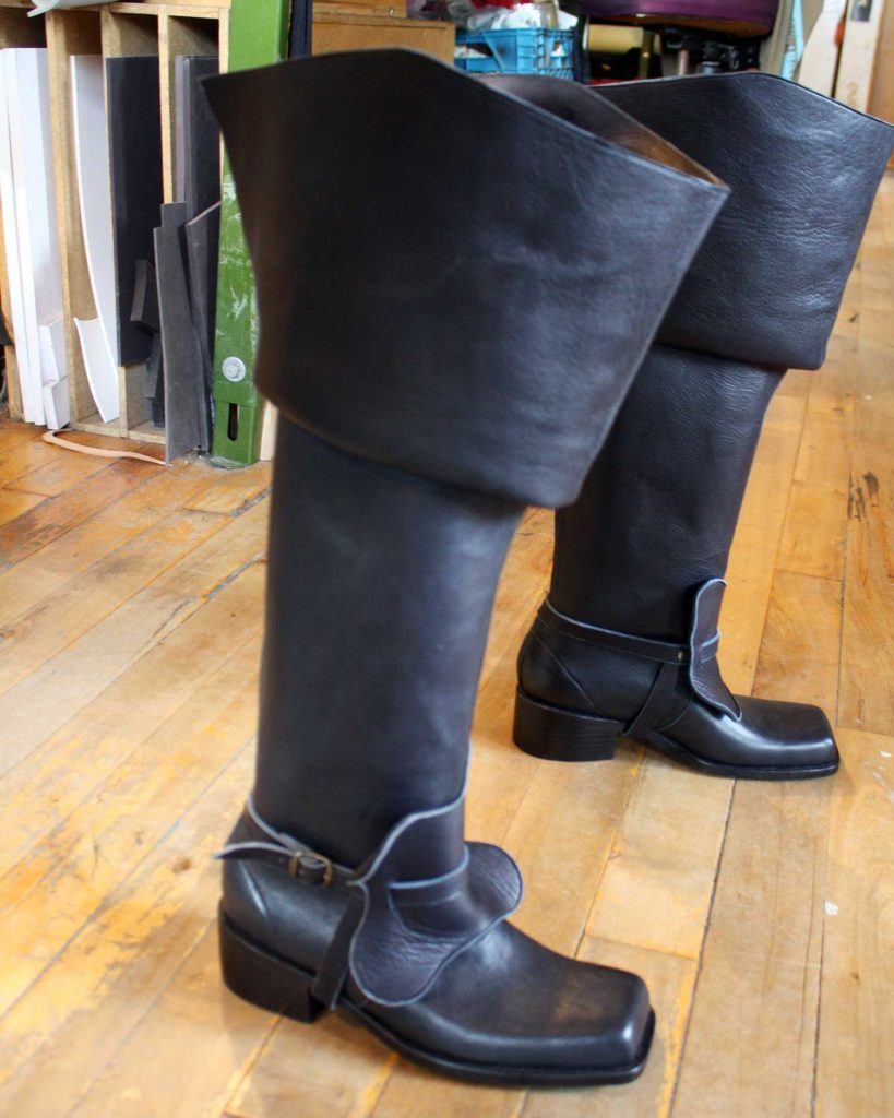 a pair of custom black leather period theatre boots