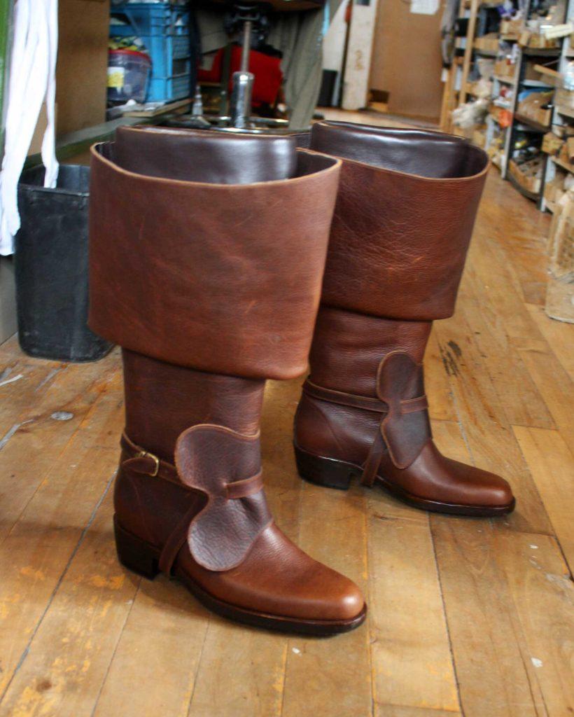 a pair of custom brown leather period theatre boots