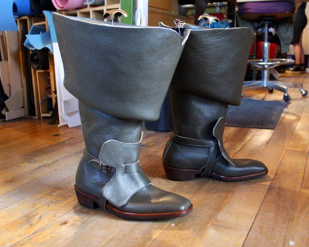 a pair of custom charcoal leather period theatre boots