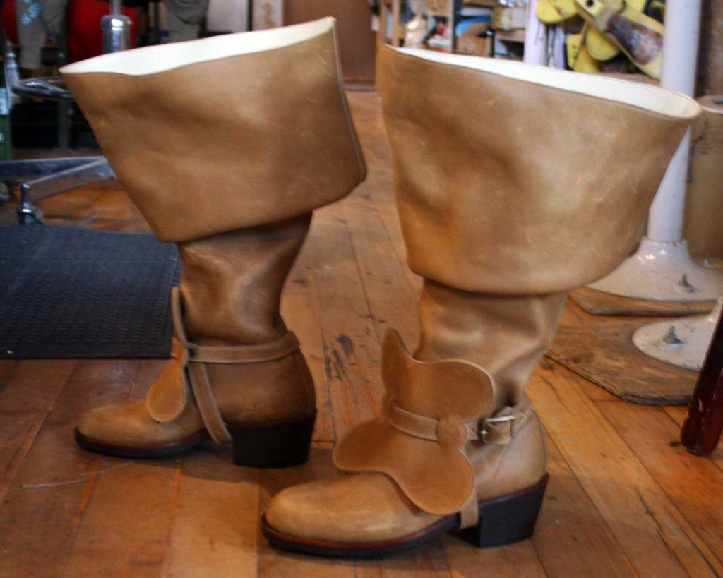 a pair of custom brown leather period theatre boots