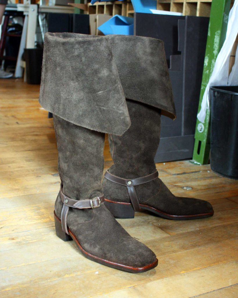a pair of custom grey period theatre boots