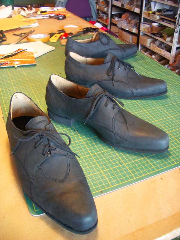 2 pair of grey shoes with lace