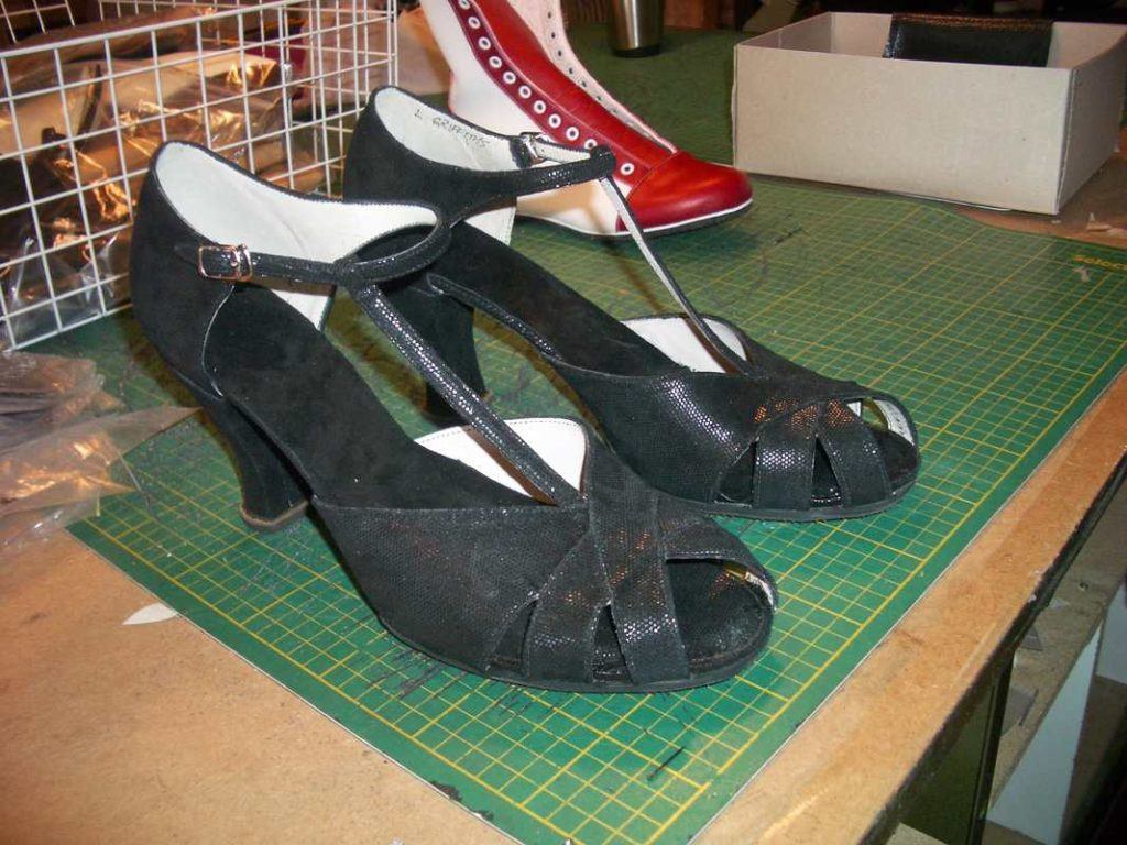 pair of black fancy sandals with heels