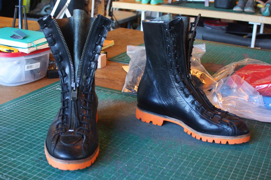 black boots with orange soles