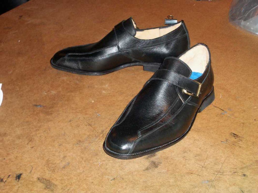 a pair of black monk shoes