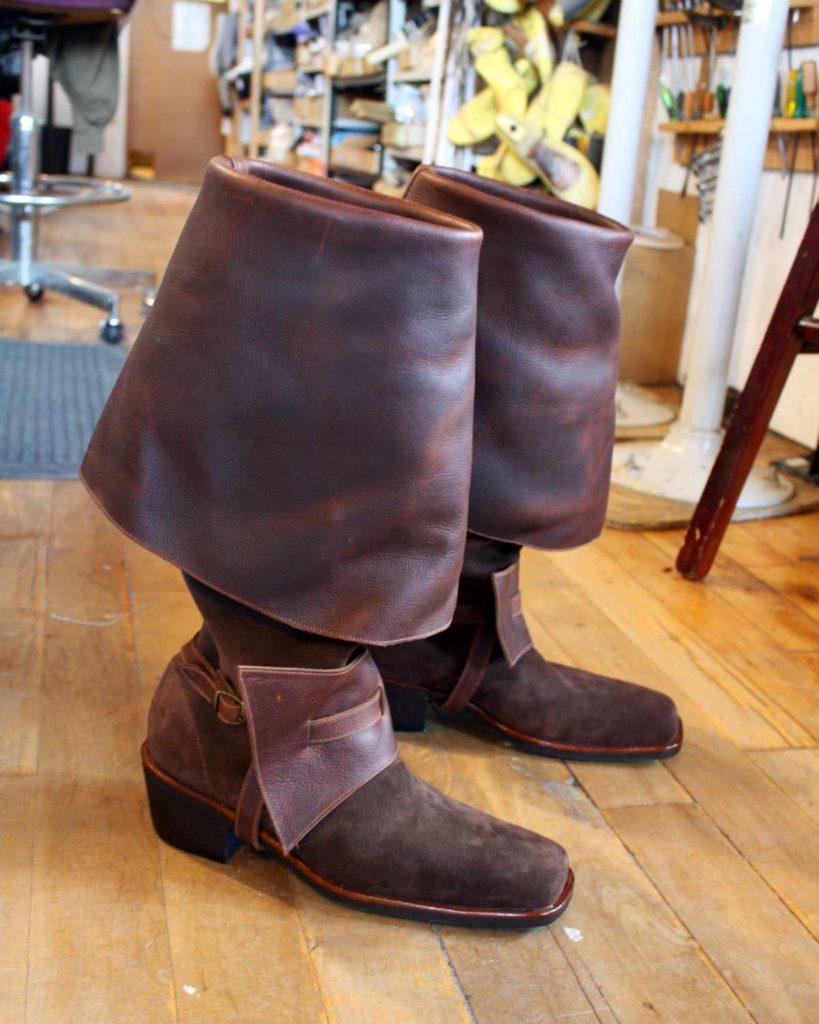 pair of brown period boots with straps
