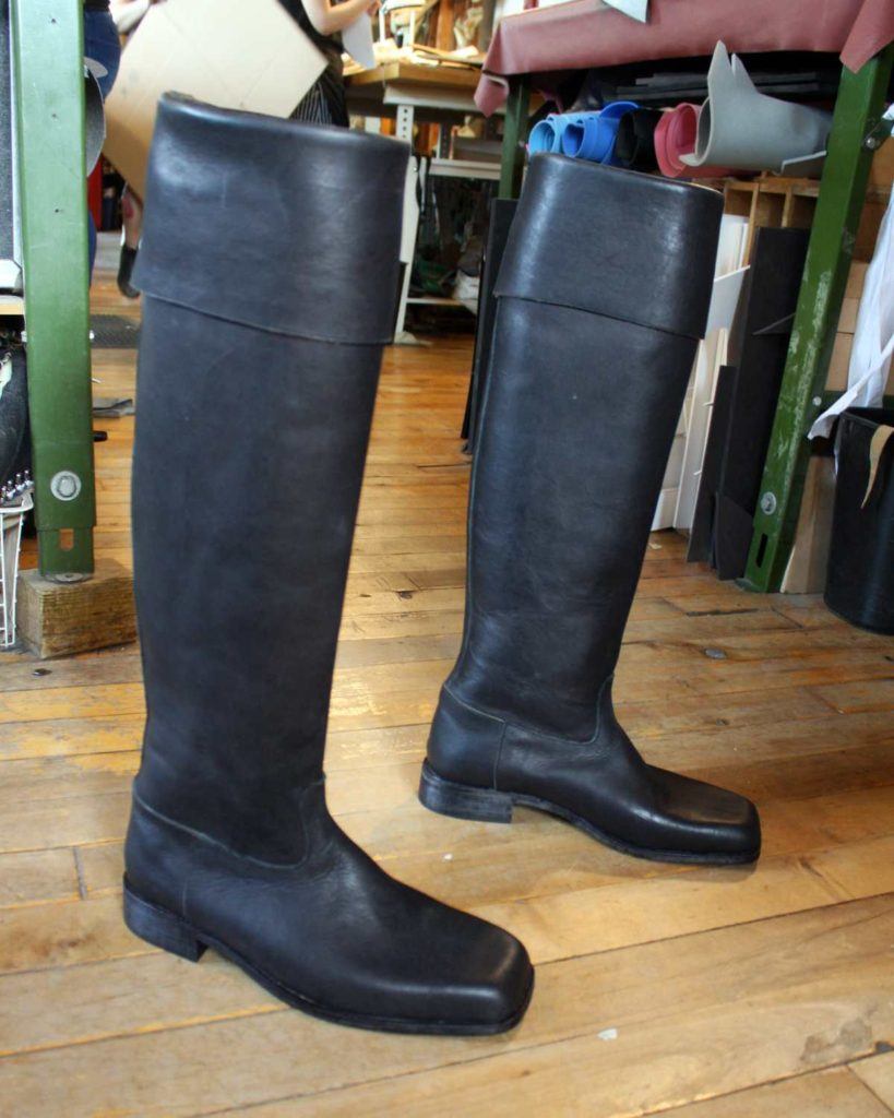 pair of black long boots