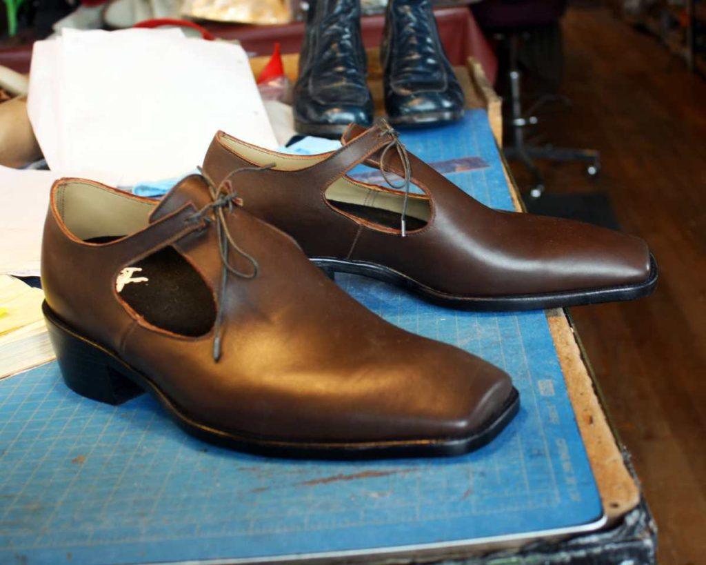 a pair of custom brown leather shoes