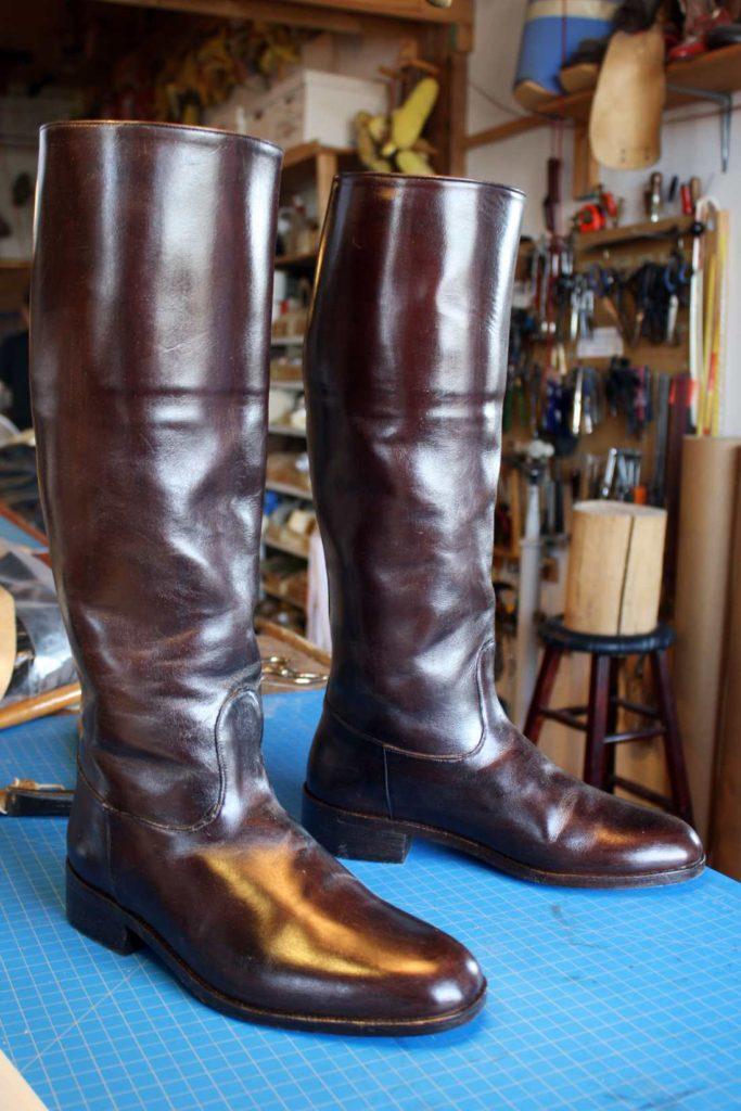 pair of brown long boots