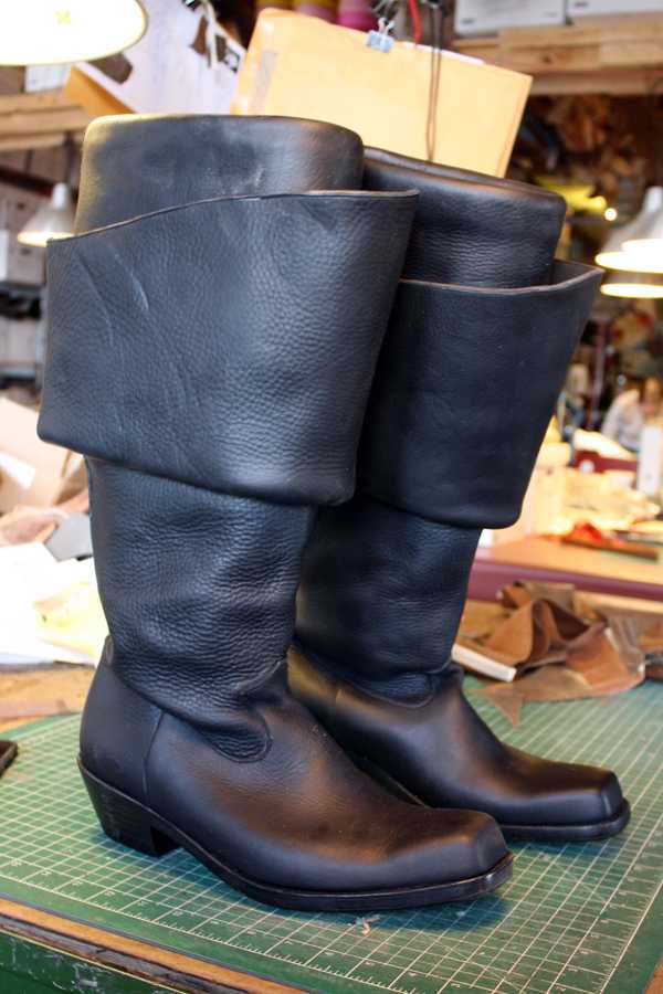 pair of black long period boots