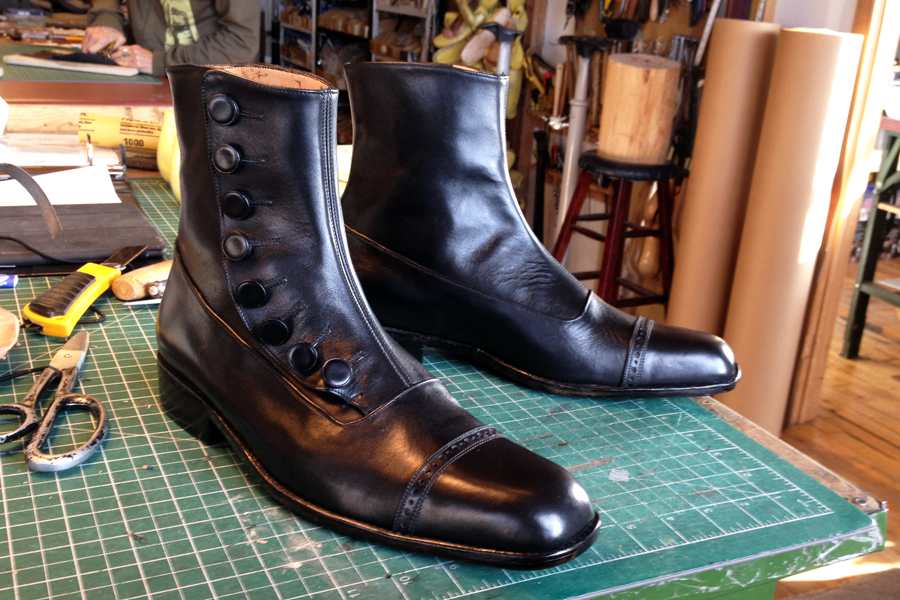 black leather boots with buttons