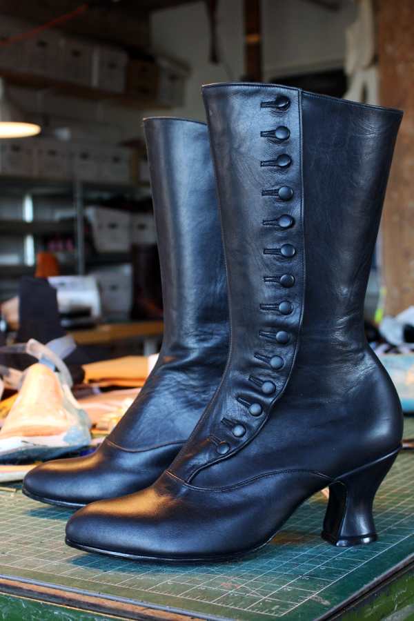 black calf length boots with buttons