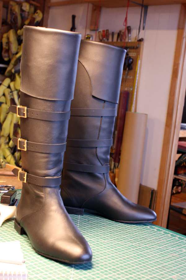 black boots with straps and buckles
