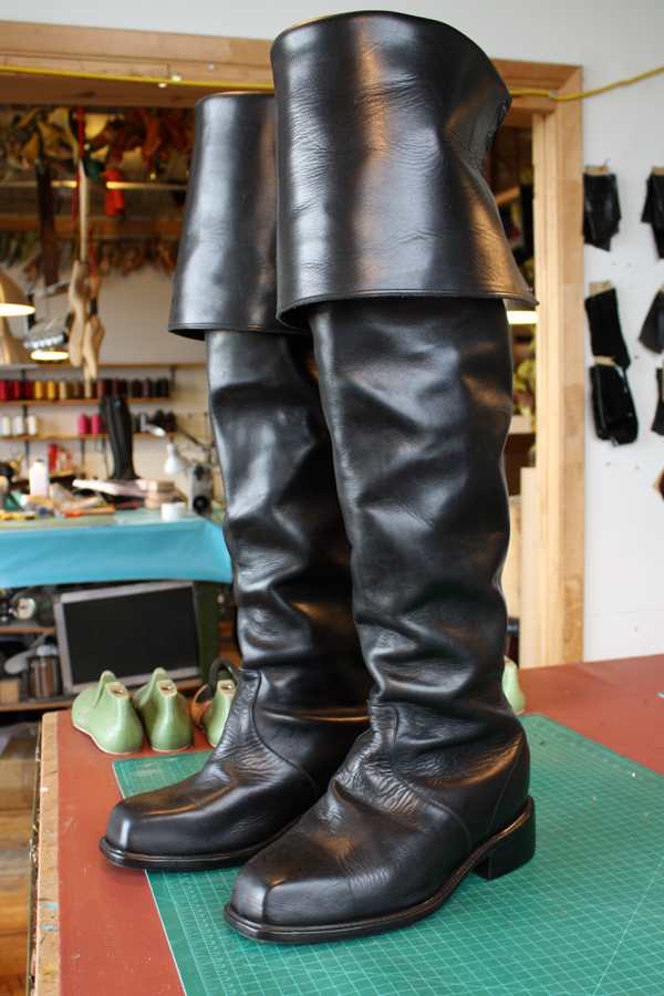 black leather knee length boots