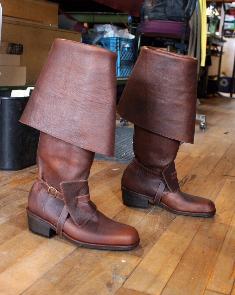 pair of brown period boots with straps