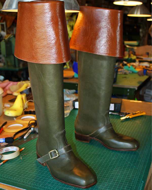 green and brown leather boots