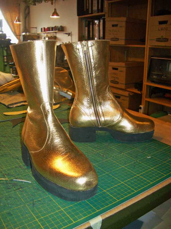 Pair of Golden boots with zip