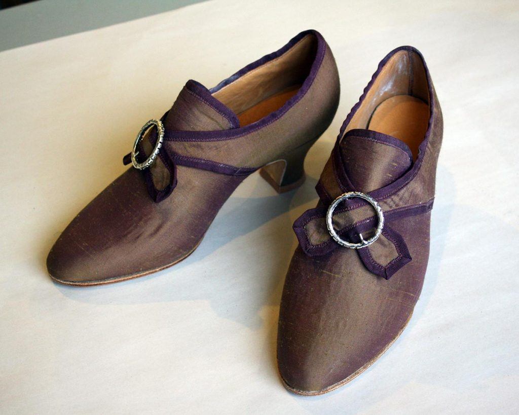 a pair of women fancy brown shoes with heels