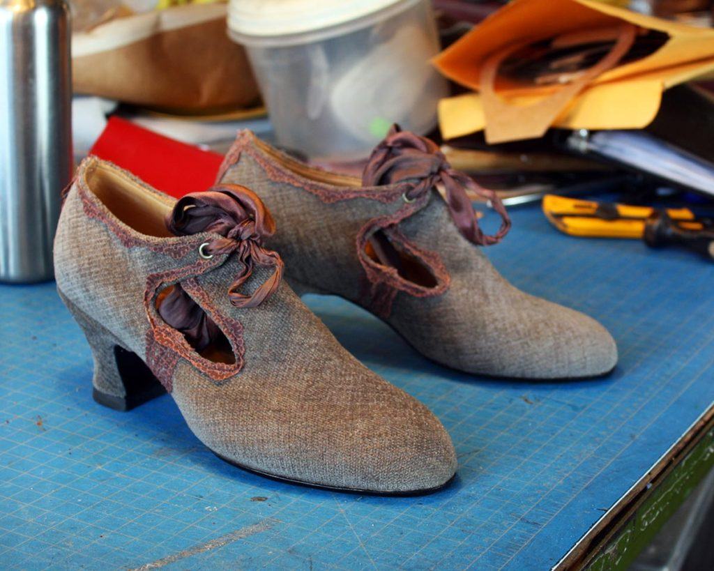 a pair of custom brown high heels shoes