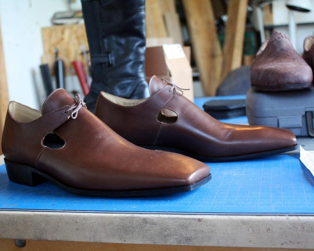 a pair of custom brown monk shoes