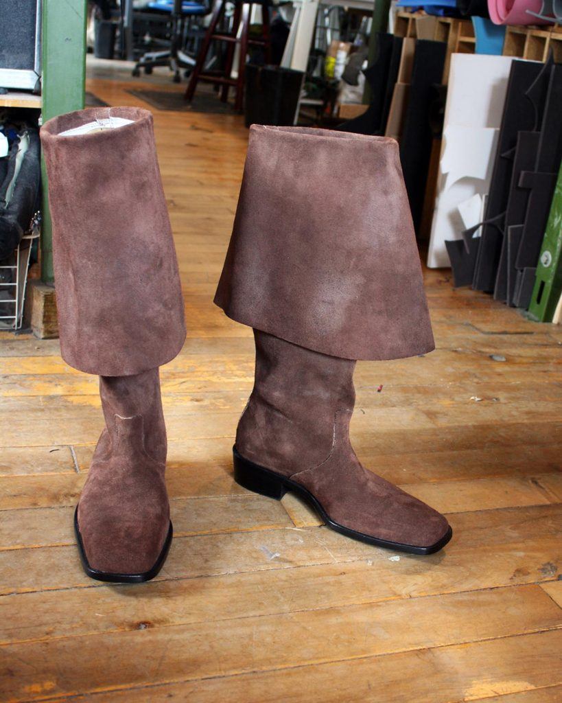 a pair of custom brown period boots