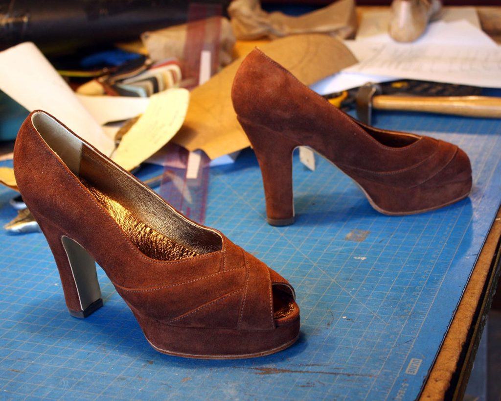 a pair of custom brown valley with high heel