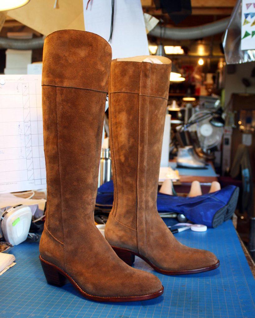 a pair of brown long boots