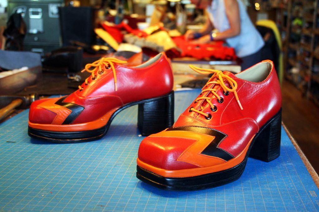 a pair of red orange & yellow shoes with heels