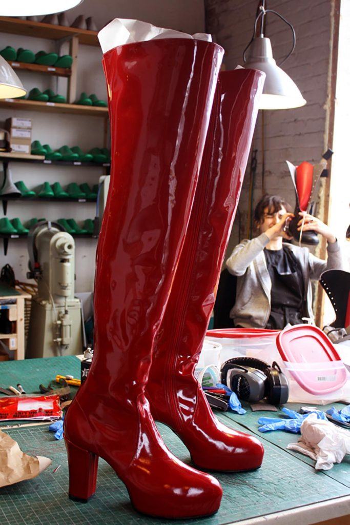 pair of red long boots with high heels