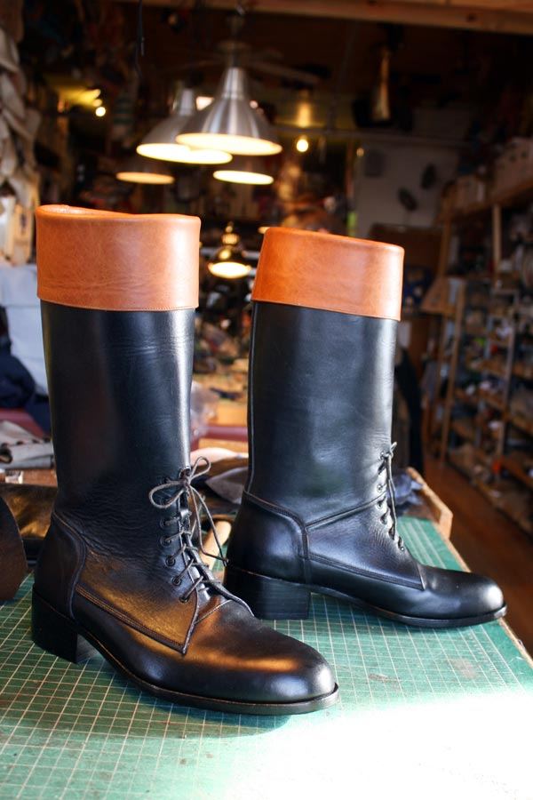 pair of black and mustard boots with lace