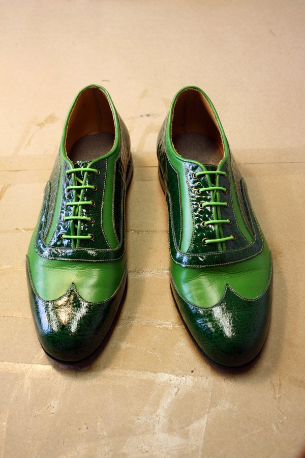 green and black leather shoes