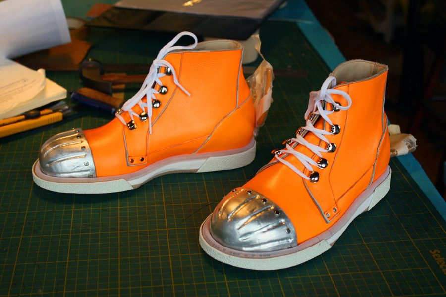 orange ankle boots with exterior steel toecaps