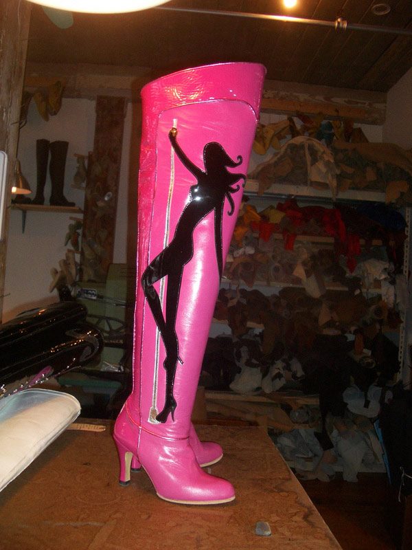 pink knee length boots with silhouette of a pole dancer