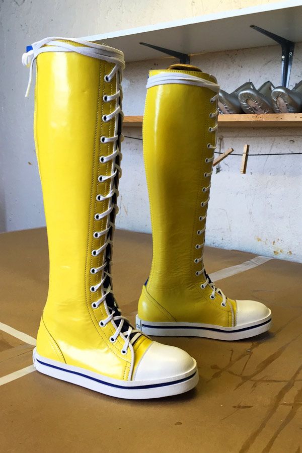 yellow knee length lace up boots