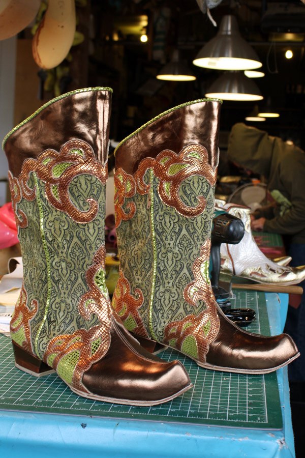 ornately engraved theatrical boots