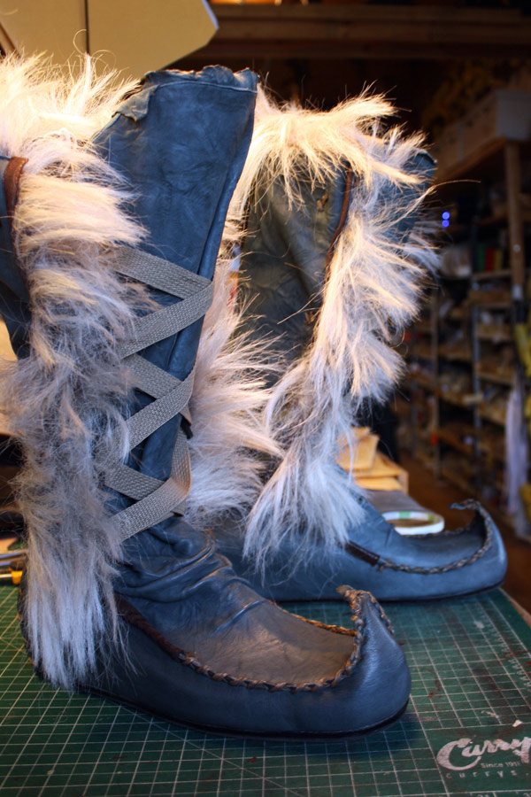 fur lined boots with upturned toes