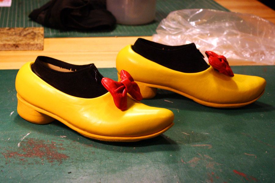 yellow shoes with red bows